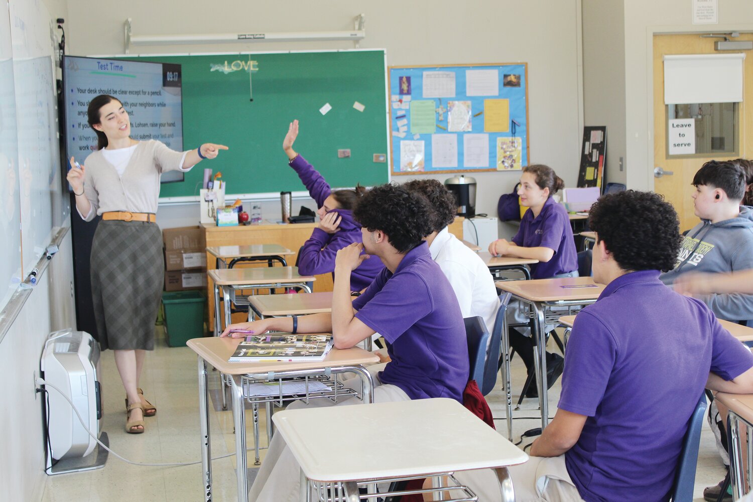 Viola Lohsen, a graduate of the Catholic Universty of America, teaches a group of her students at St. Raphael Academy during a year of service while earning her master’s degree at Providence College as part of the PACT program.